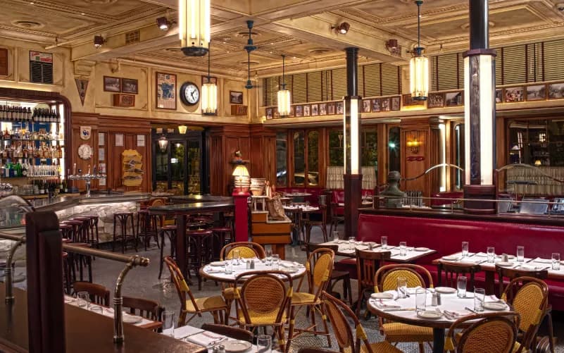 Interior of Le Diplomate in Logan Circle, featuring classic French bistro décor and tables set for dining.
